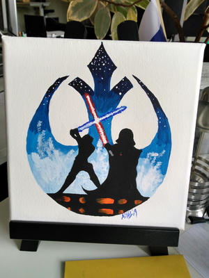 An art piece that my wife painted as a desk decoration. Small canvas with silouettes of Luke Skywalker and Darth Vader dueling in cloud city with the rebels' symbol framing the background