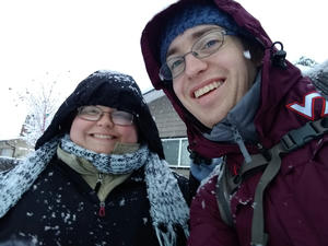 My wife and I in our snow gear in front of our new home