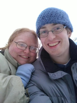 Moogle, our cat, a orange kitty with tiger stripes on his noggin